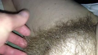 Rubbing my wife's hairy snatch in front of a camera