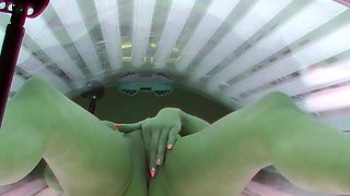 Sexy MILF masturbating in solarium