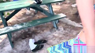 Two cute college girls foursome while having a picnic