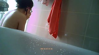 Innocent asian spy in a bathroom