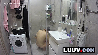 LUUV. Tattooed Alice gets ready for the evening reality show segment in the shower