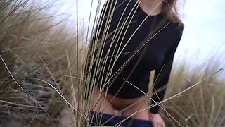Outdoor handjob on beach with cumshot