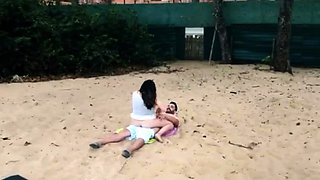 Beach voyeur filming brunette teen riding boyfriend's cock