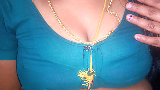 Tamil aunty squeezing her breasts when she is alone and unable to control her emotions.
