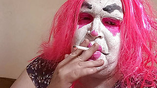 Femme TV clown smokes and gives jerk off instruction