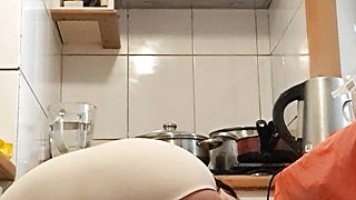 Mature milf in the kitchen cooking for stepson