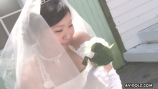 Naughty and quite buxom Japanese bride Emi Koizumi gives a good blowjob