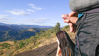 Tour Guide Shows Stick to Tourist on Mountain