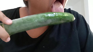 Fat mom inserts a cucumber into her chubby pussy