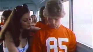 Charming blonde girl gives head to a sportsman in a bus
