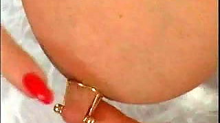 German Girl plays with her large pierced nipples 2