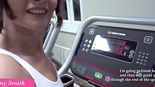 Athletic milf with big tits exposes her rack while working out in gym