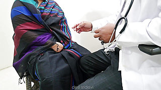 Doctor Rahul checking sridevi in a clinic