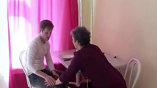 Russian mature whore Tanya with boy on the table