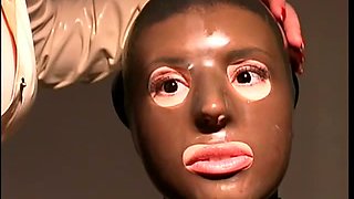 Slave Girl Wrapped In Skintight Latex