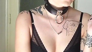 Tattooed gothic lady smoking in the kitchen