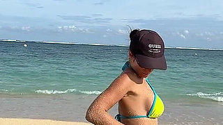 Teasing on the Beach in Micro Bikini on the Sand