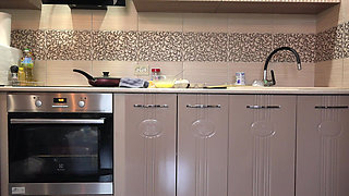 A Mature Wife Prepares Breakfast, and the Home Camera Watches. Big Ass in White Panties Under a Short Robe