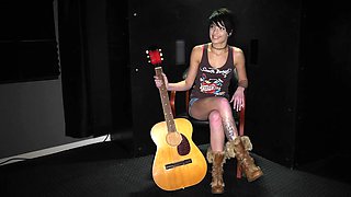 The backstage of a tattooed brunette girl, Kodi Jett, during filming