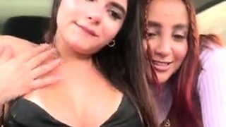Redhead and brunette lesbians play outdoors