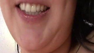 Raven haired hottie Marille strips and squeezes her massive natural tits before revealing her pussy