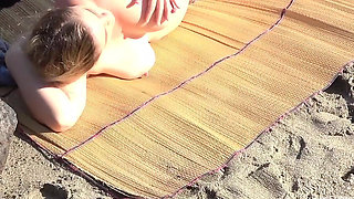 Watching dude fucks blonde MILF on the beach