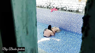 A neighboring couple was seen secretly having sex in the swimming pool.