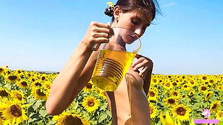 Fertility goddess plays with herself in a sunflower field