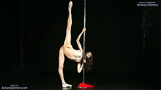 Gorgeous nude ballerina Annett A dances on a pole. Girl dancer spreads her flexible long legs wide