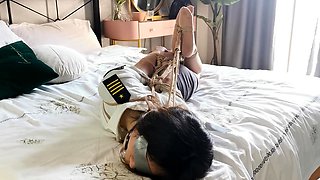 chinese hogtie on bed