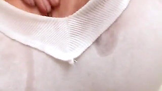 Classy redhead Eden Mor oils up her big natural tits in the bathtub