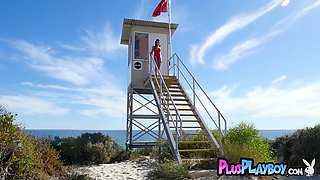 Stunning lifeguard posing on the beach