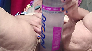 Big Bottle Plugged Clit Cunt