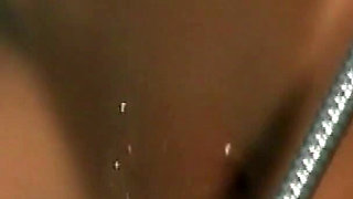 Mature MILF Explores Her Curves in Steamy Shower