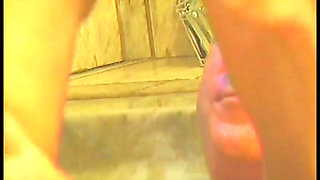 Blonde stretches her cunt with big dildo before bathroom doggy style fuck