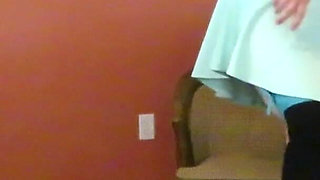 Nurse Vicki plays with a rubber ball in a mini skirt, sexy stockings and high heel mini boots