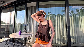 Hot Long Legs Sexy Beauty on the Balcony Flashes Her Panties Under Her Skirt Then Takes Underwear off to Show Tight Pussy