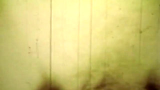 Worn Sepia Loop Captures Curly Retro Couple in Raw Bedroom Passion