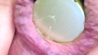 Close-up of a bottle inserted into the anus...