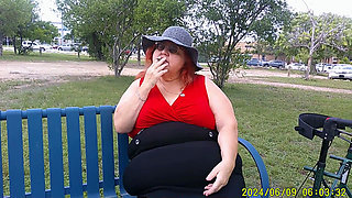 Nurse Vicki Smoking in the Park on a Bench All Dressed up