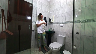 Maid changing clothes in the bathroom.