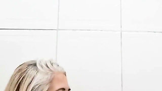 In the Bathroom, Sticking Dildo in Her Pussy