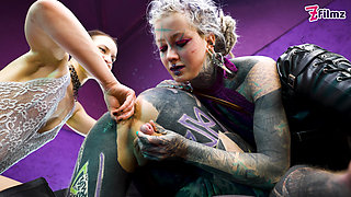 Heavy Tattooed Sub Played with and Pegged by 2 Dominas