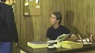 In a kitchen a sexy brunette playing with her big boobs