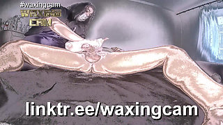 A Nurse in White Gloves Waxes a Guy