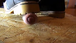 Domina crushes cock with high heels