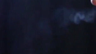 Sexy Lady in Red Is Smoking Two 100mm Reds