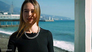 Young Russian Girl Smoking Cigarette by Seaside