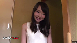 Sultry Japanese brunette housewife indulges in a steamy porn journey .