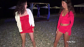 Brunette Friends Piss Together on Beach